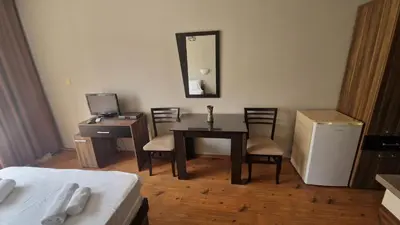 a room with a desk and a table and a bed at MitProt Panorama Bay 2 Studio 67 in Sveti Vlas