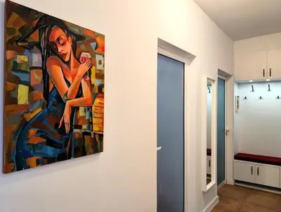 a painting of a woman on a wall in a room at The Puzzle in Varna City