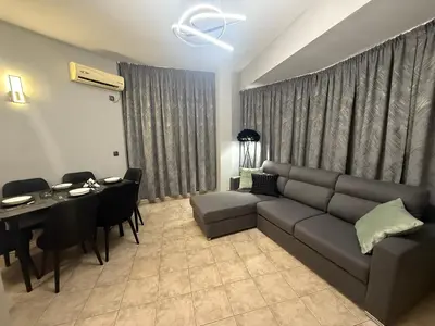 a living room with a couch and a table at YS Platinum Residence in Sunny Beach