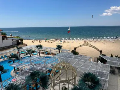 a view of a beach with a roller coaster at Апартамент в КК 