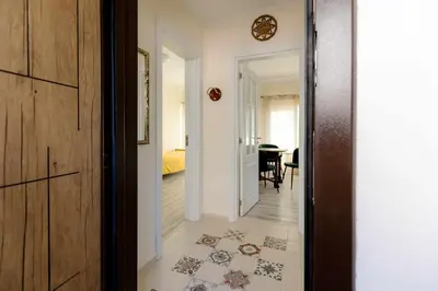 a hallway with a door leading to a room at Mila 6 in Burgas City