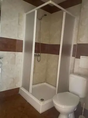 a bathroom with a shower and a toilet at Ground Floor, 2-Bed Apartment in Sunny Beach