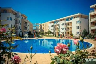 a large swimming pool in front of some buildings at Ground Floor, 2-Bed Apartment in Sunny Beach