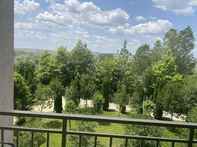 a balcony with a view of trees and grass at Family, Friendly 2 Bed Apartment in Sunny Beach