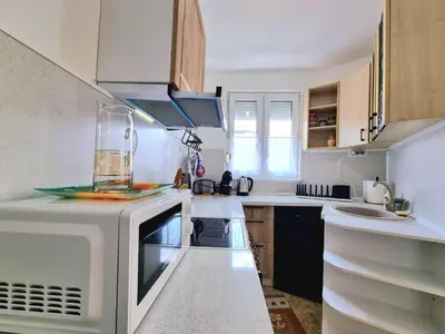 a kitchen with a microwave and a sink at Central - 3BD Holiday Apartment for Family & Friends in Burgas City