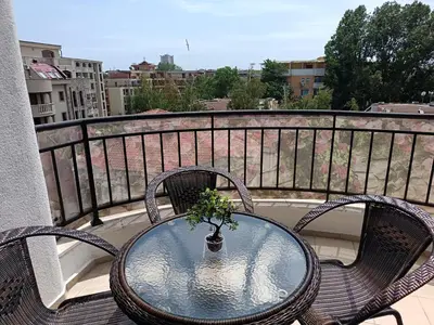 a table and two chairs on a balcony at Aura Blu Studio in Sunny Beach