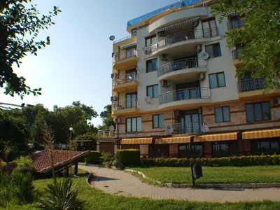 a tall building with a walkway in front of it at Nessebar View Apartament in Nesebar