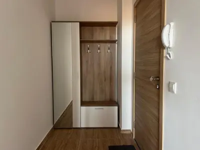a hallway with a door to a locker room at Deluxe Apartment with Sea View Vineyard Spa Resort Aheloy in Aheloy