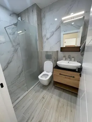a bathroom with a toilet and a sink and a shower at Сарафово in Burgas City