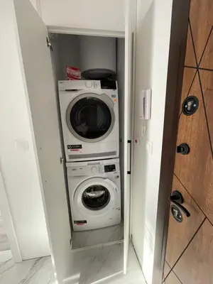 a washer and dryer in a small room at Сарафово in Burgas City