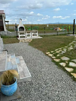 a park with a bench and a table and grass at Морски Бриз in Lozenets