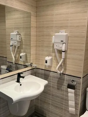a bathroom with a sink and a mirror at Hotel Grenada in Sunny Beach