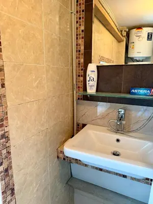 a bathroom with a white sink in a room at Art Lux Studio 1 in Burgas City