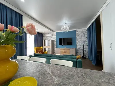 a living room with a couch and a table at Bayview Family 2 in Burgas City