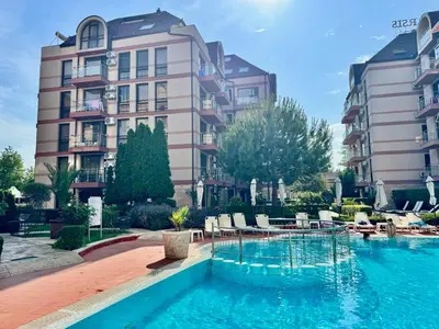 a hotel with a swimming pool in front of a building at Apartment B48 in Tarsis Club Complex in Sunny Beach