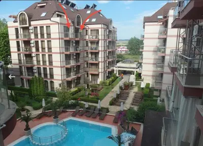 an apartment building with a swimming pool in front of it at Apartment B48 in Tarsis Club Complex in Sunny Beach