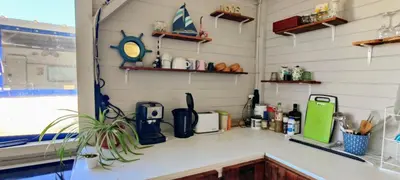 a kitchen with a counter top with a sink at Яката Каравана in Kiten
