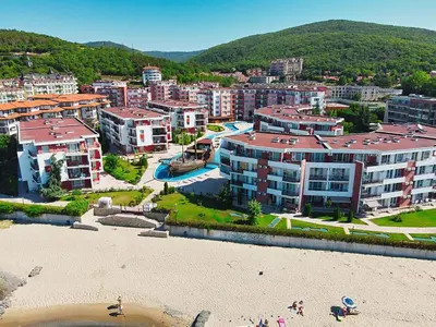 an aerial view of a city with buildings and a beach at Beachfront Studio with Sea Views in Sveti Vlas