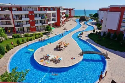 a view of a swimming pool at a resort at Beachfront Studio with Sea Views in Sveti Vlas