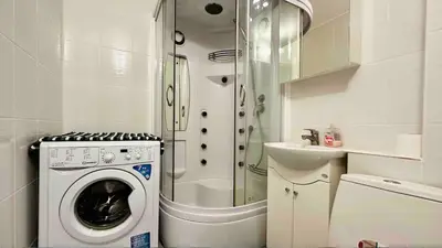 a small bathroom with a washing machine and a sink at Dolce Vita 1 Ap-6 in Sveti Vlas