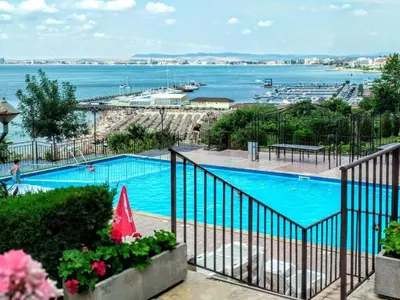 a swimming pool with a view of the water at Dolce Vita 1 Ap-6 in Sveti Vlas