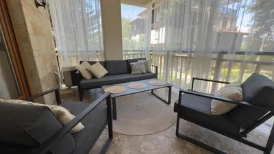 a living room with a couch and a table at Summer Mood, Forest Feeling in Sozopol in Sozopol