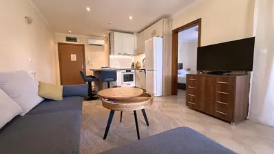a living room with a couch and a table at Summer Mood, Forest Feeling in Sozopol in Sozopol