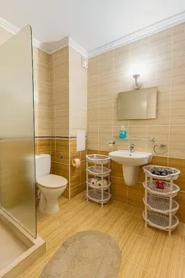 a bathroom with a toilet and a sink and a shower at Antonia Seaside Comfort in Sveti Vlas