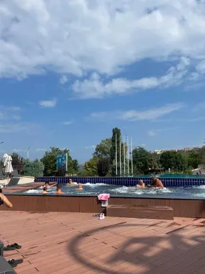 a group of people swimming in a swimming pool at Apartment at the Seaside in Sozopol