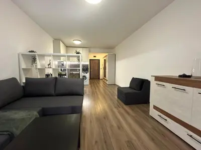a living room with a couch and a table at Relaxing studio in Shartrez in Shkorpilovtsi