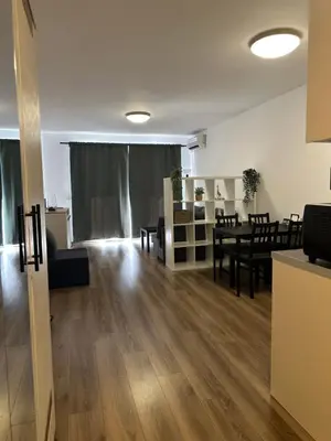 a living room with a table and a dining room at Relaxing studio in Shartrez in Shkorpilovtsi