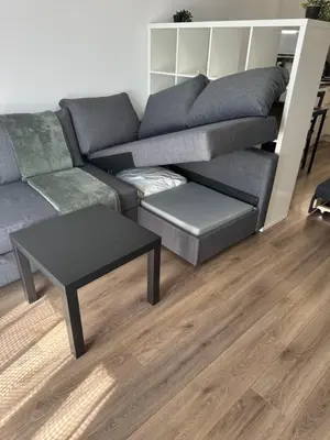 a living room with a couch and a table at Relaxing studio in Shartrez in Shkorpilovtsi