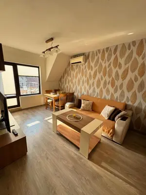 a living room with a couch and a table at Downtown Harmony Chill Place in Varna City