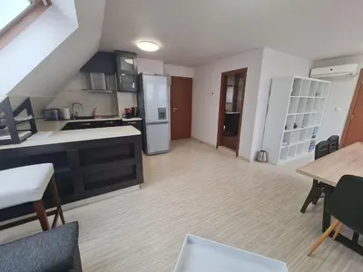 an open kitchen and dining area of a apartment at 