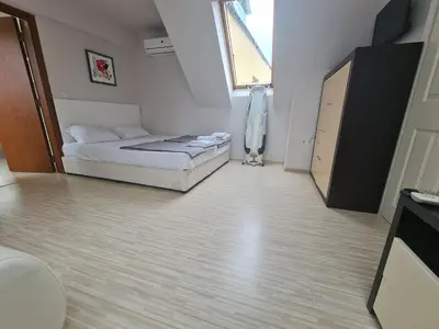 a bedroom with a bed and a large window at 