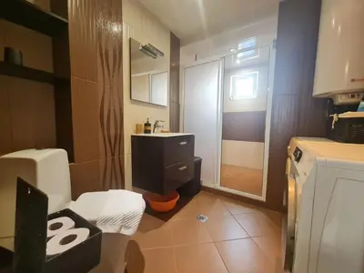 a small bathroom with a sink and a shower at 