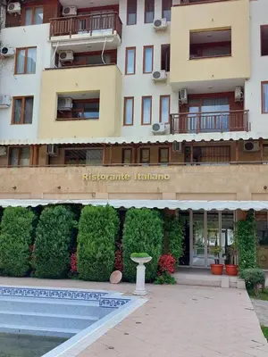 a building with a sign that reads redeeming healthcare at Garden of Eden K 518 in Sveti Vlas