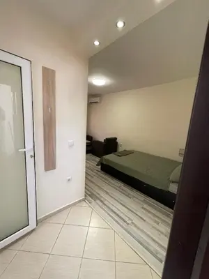 a bedroom with a bed in a room at Mila 5 in Burgas City