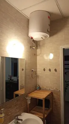 a bathroom with a sink and a mirror at Grand Kamelia C1 in Sunny Beach