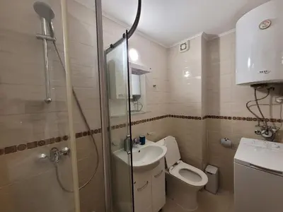 a bathroom with a shower and a toilet and a sink at Ela, Kedar 7 in Sveti Vlas