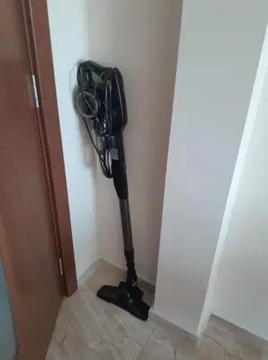 a vacuum in the corner of a room at Laguna 3 минуты до моря in Pomorie