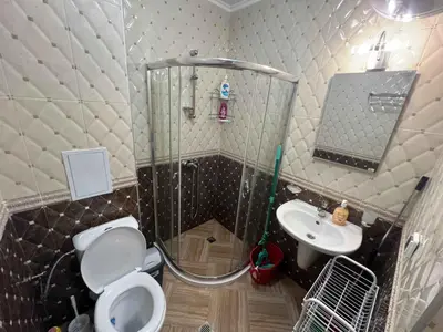 a bathroom with a shower and a toilet and a sink at Laguna 3 минуты до моря in Pomorie