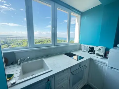 a kitchen with two sinks and two windows at Lazur Sea Home Burgas 2BD in Burgas City