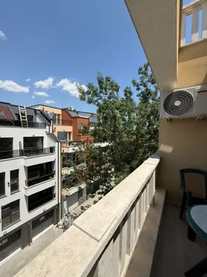 a balcony with a view of a building at Sea Side in Burgas City