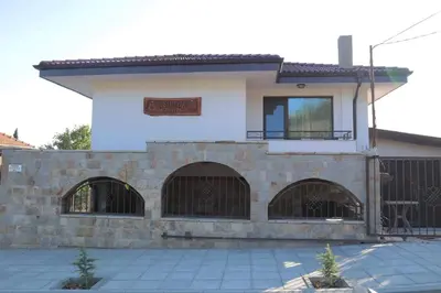 a house with two gates in front of it at Конакъ Войнов in Yasna Polyana