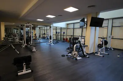 a gym with several treadmills and machines at PARADISO B 410 Studio with SEA VIEW in Nesebar