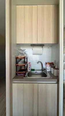 a kitchen with a sink and wooden cabinets at PARADISO B 410 Studio with SEA VIEW in Nesebar