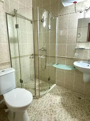 a bathroom with a shower and a toilet and a sink at Royal Dreams apartments - 2 in Sunny Beach