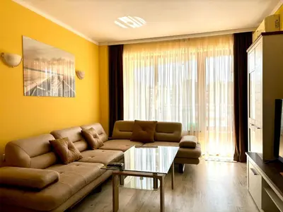 a living room with a couch and a table at Royal Dreams apartments - 2 in Sunny Beach