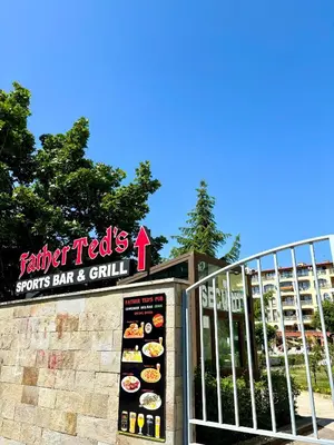a sign in front of a fast food restaurant at Royal Dreams apartments - 2 in Sunny Beach